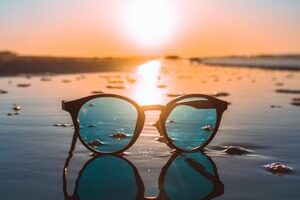 black framed teal lens sunglasses during daytime