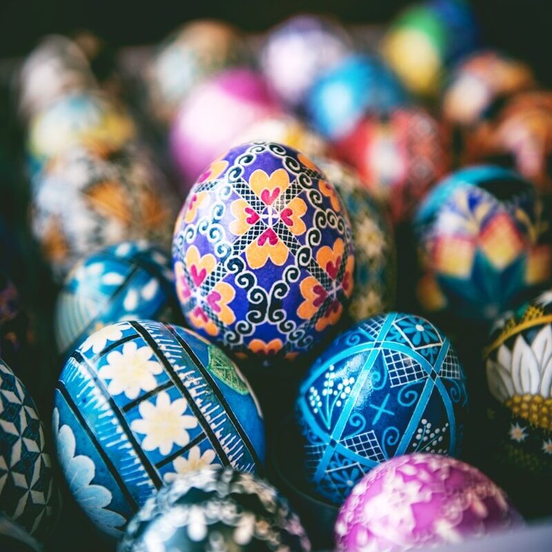 a bunch of colorful easter eggs in a box