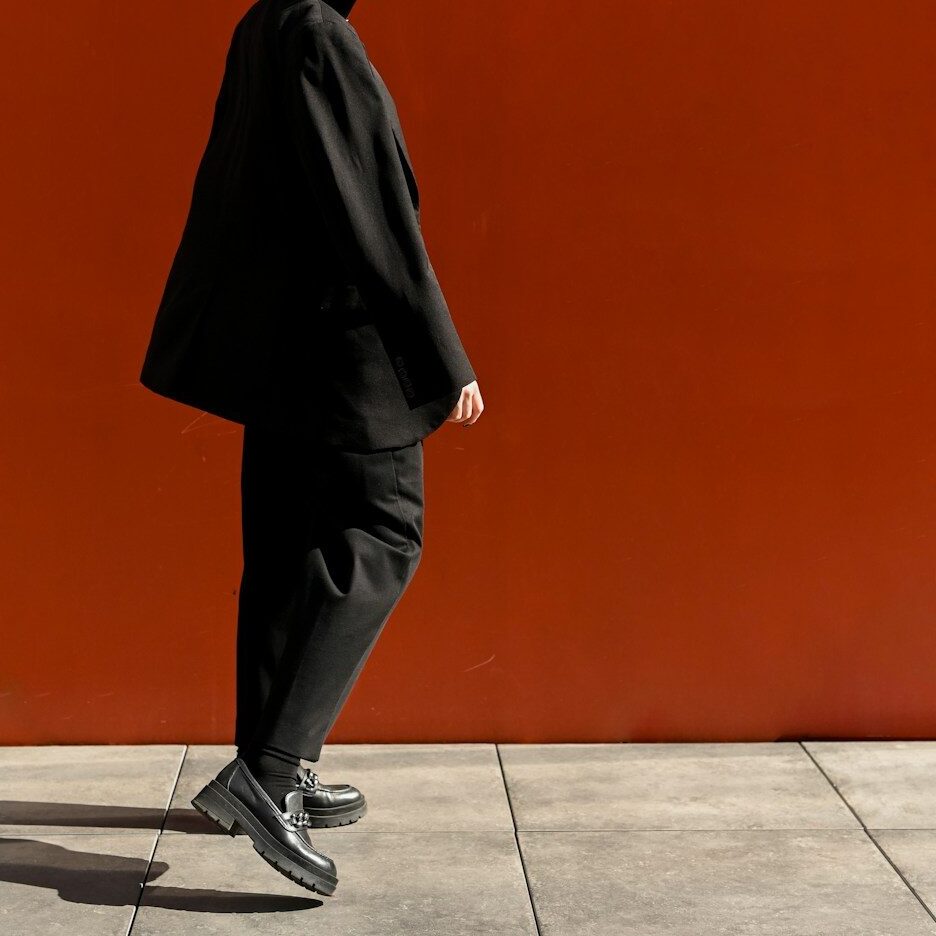 a man in a black coat