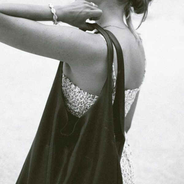 grayscale photo of woman wearing cami top