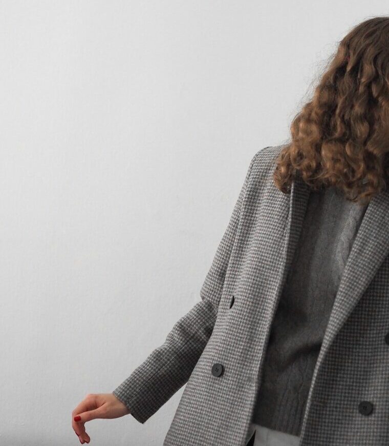 a man in a grey coat